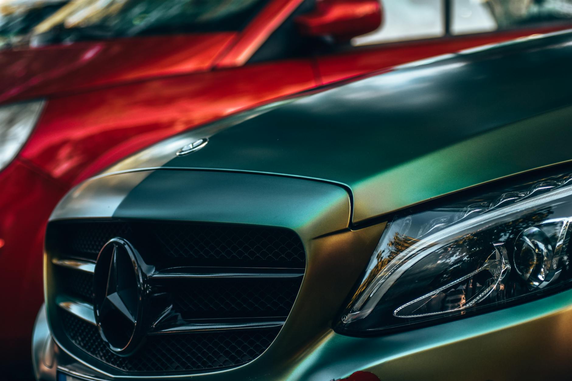 green mercedes benz car in close up photography