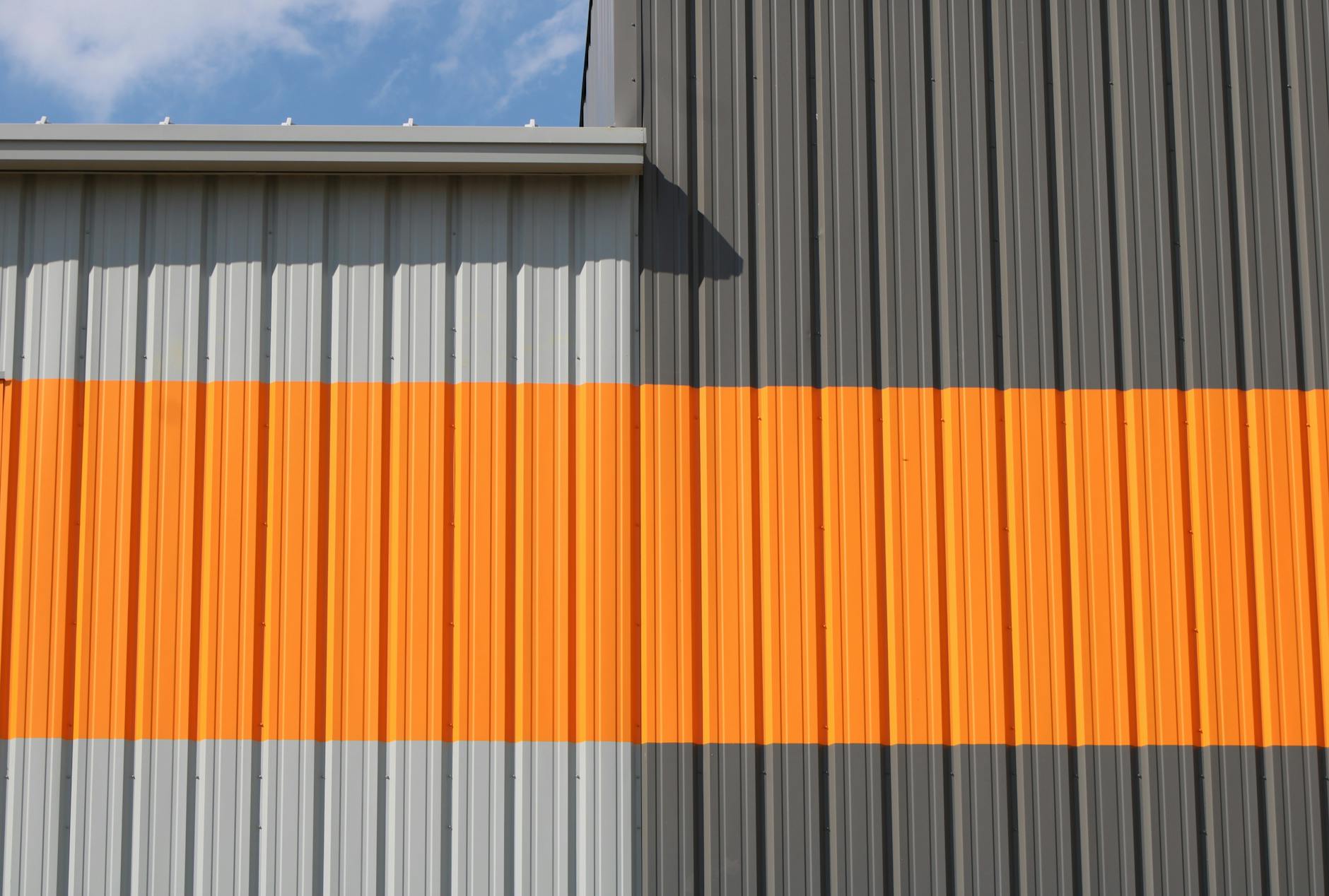 industrial building with orange and gray siding