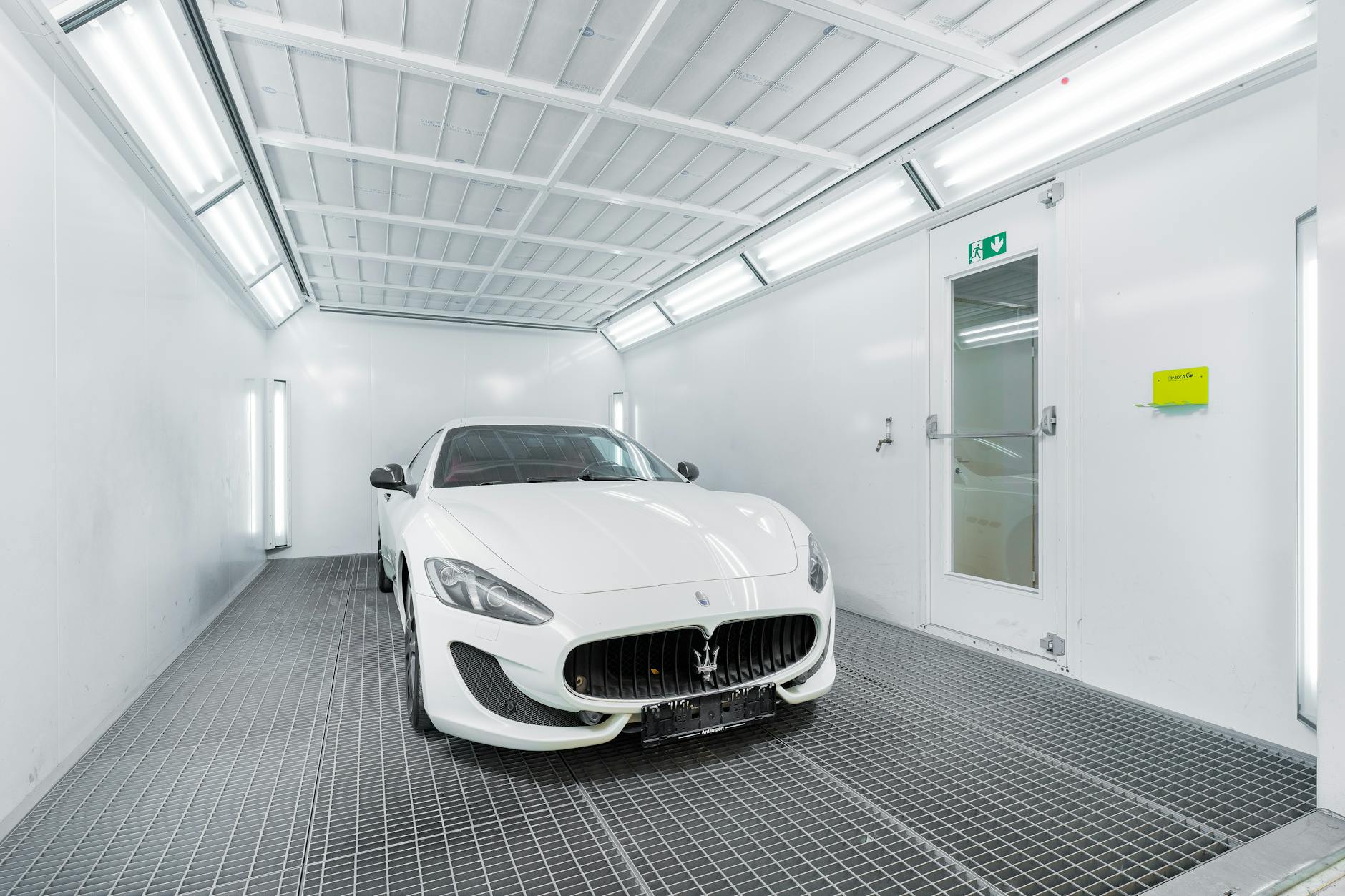 luxury car in modern paint booth