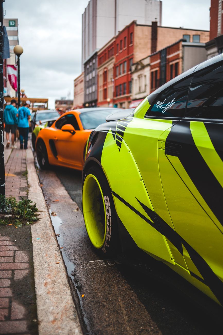 bright sports cars parked on street